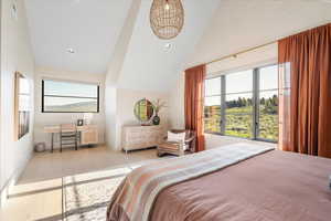 Bedroom with lofted ceiling, wood finished floors, and recessed lighting