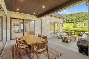 View of patio with an outdoor fire pit
