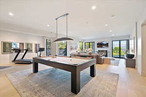 Playroom with pool table, healthy amount of natural light, light wood-style floors, and recessed lighting