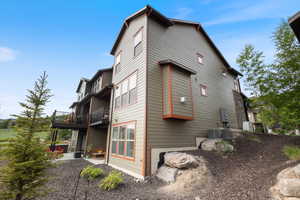 View of side of property with a balcony