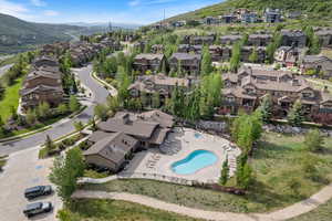 Aerial view of property's location featuring nearby suburban area and a mountain backdrop