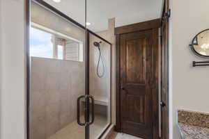 Bathroom with a stall shower and vanity