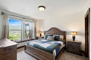 Carpeted bedroom with baseboards