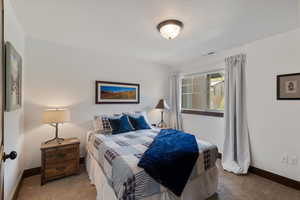 Bedroom with carpet and baseboards