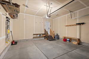 Garage featuring a garage door opener