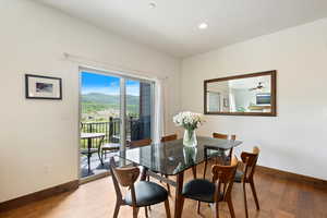 Dining room featuring hardwood / wood-style flooring, recessed lighting, and a mountain view