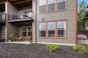 Back of property with a balcony
