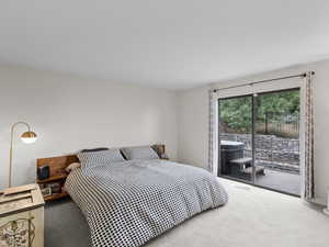Primary Bedroom featuring carpet floors and access to outside