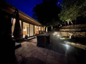Patio at twilight featuring a patio