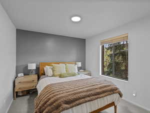 Carpeted bedroom with baseboards
