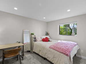 Bedroom with carpet flooring and recessed lighting