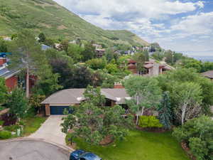 Aerial view of residential area featuring a mountainous background