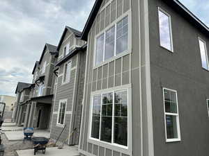View of side of home with a patio