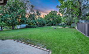Fenced backyard featuring a patio area