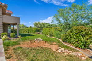 View of green lawn with ceiling fan