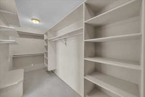 Walk in closet featuring carpet