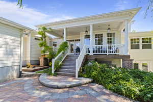 Property entrance with covered porch