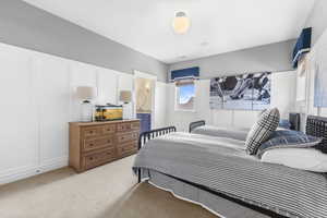 Bedroom with light carpet