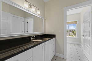 Bathroom with vanity and tile patterned flooring