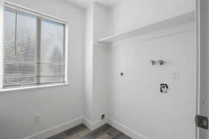Laundry room featuring washer hookup, hookup for an electric dryer, and dark wood finished floors