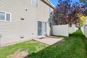 Rear view of property with a patio