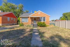 Bungalow with brick siding