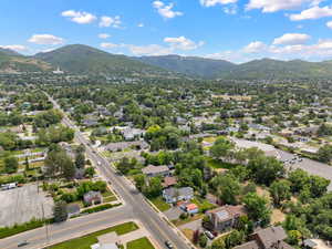 Aerial view of residential area featuring a mountainous background