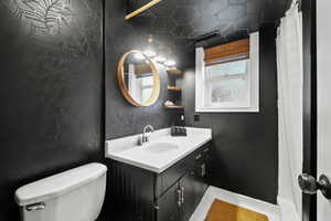 Full bathroom featuring vanity and a shower with curtain