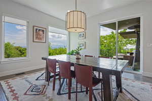 Dining space featuring baseboards and wood finished floors
