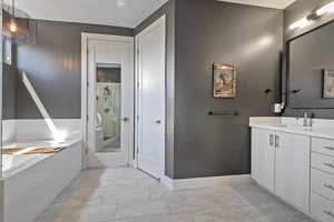Full bathroom with vanity, a shower stall, and a bath
