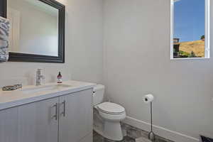 Bathroom with toilet and vanity