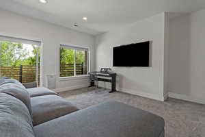 Living room featuring carpet and recessed lighting