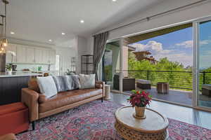 Living area featuring plenty of natural light, recessed lighting, and wood finished floors