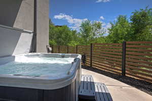 View of patio / terrace featuring a hot tub