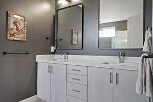Bathroom featuring double vanity