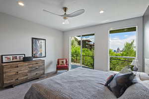 Carpeted bedroom featuring access to outside, recessed lighting, and ceiling fan