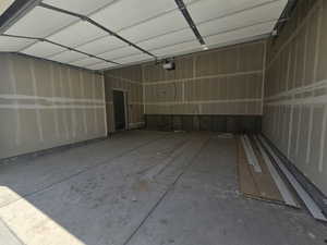 Garage featuring a garage door opener