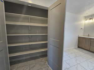 Storage area featuring a sink