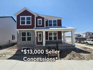 View of front of house with covered porch and board and batten siding