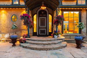Property entrance featuring stucco siding