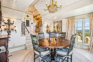Dining area with a chandelier, stairs, light tile patterned floors, and recessed lighting