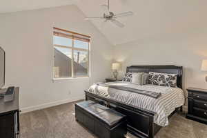 Bedroom with carpet floors, lofted ceiling, and ceiling fan