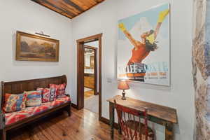Living area with wood-type flooring and baseboards