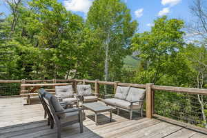 Deck featuring outdoor lounge area