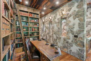 Home office featuring wood ceiling and hardwood / wood-style floors