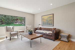 Living room featuring recessed lighting and light wood-type flooring