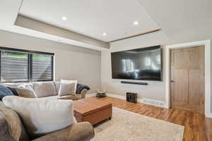 Living room featuring wood finished floors and recessed lighting