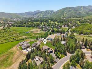 Aerial view of residential area featuring a mountainous background