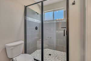 Bathroom with toilet and a shower stall