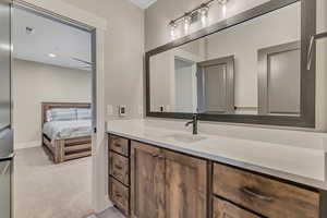 Ensuite bathroom featuring vanity and recessed lighting